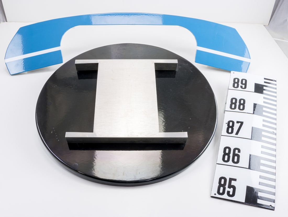 Three enameled steel signs: Three enameled steel signs, including telephone and the letter 'I', greatest 35"l