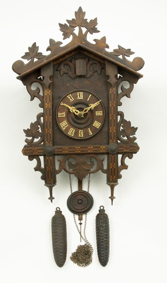 A Black Forest marquetry decorated cuckoo clock (1 of 1)