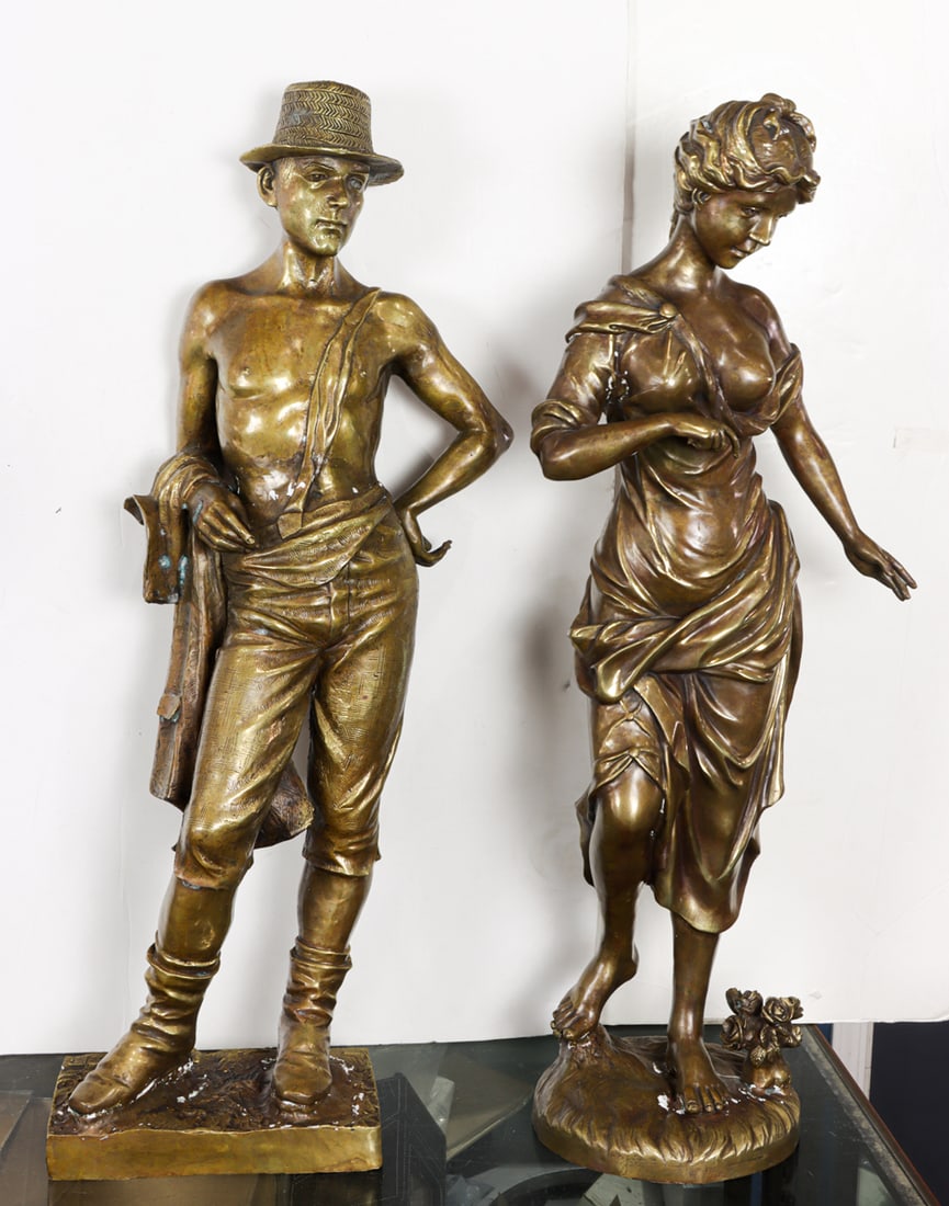 An assembled pair of bronze figures of a man and woman: An assembled pair of bronze figures of a man and woman, late 20th century, each attired in rustic costume, greatest 32"h x 10"w x 6.5"d (base)