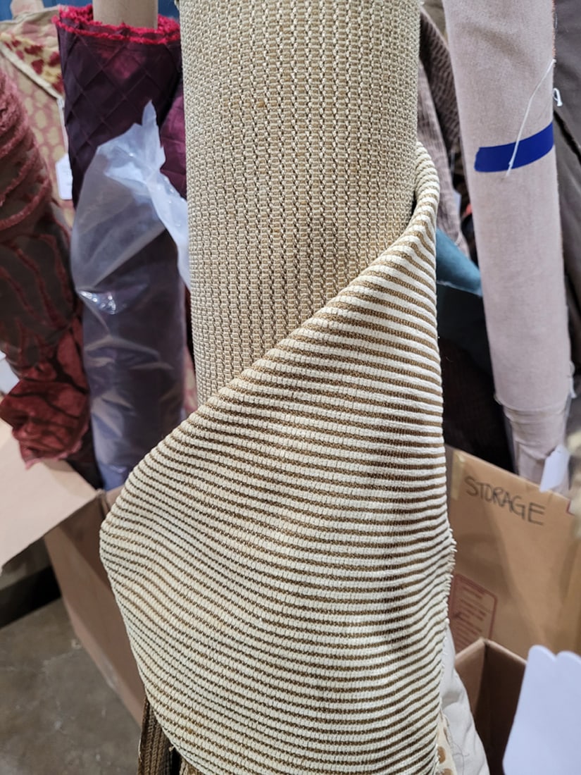 A group of four gold and wheat toned fabrics: A group of four gold and wheat toned fabrics, largest 56"w