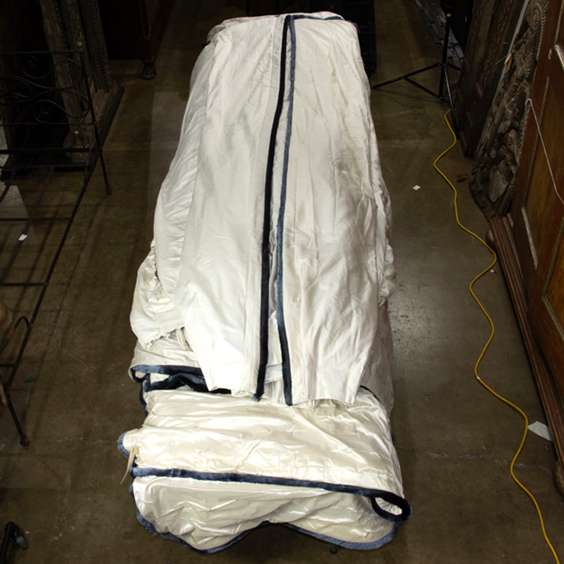 A group of custom ivory silk and tassel decorated black-out curtains, sizes include 8' x 80" (2) 8': A group of custom ivory silk and tassel decorated black-out curtains, sizes include 8' x 80" (2) 8' x 50", (2) approx 9' x 10' and 8' x 86"w Provenance: Property from the 2015 San Francisco Decorator