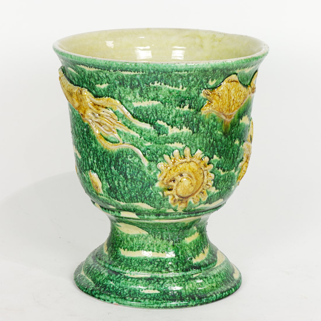 An Italian Montelupo majolica urn: An Italian Montelupo majolica urn, relief decorated with sea creatures, signed 'Nidolfi, Montelupo, Italy', 11.25"h x 9.25"dia