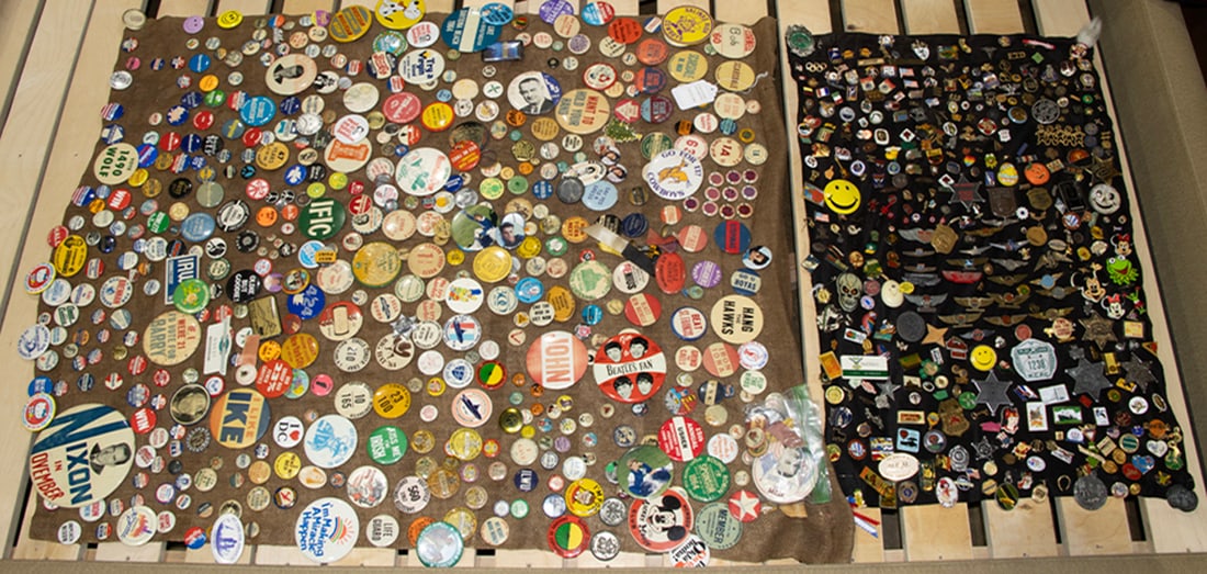 An assemblage of pin-back buttons: An assemblage of pin-back buttons, including various political, pop-culture and other memorabilia, dimensions vary