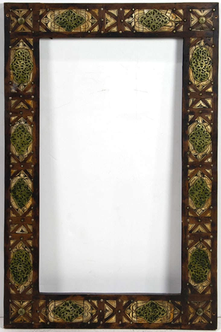 A Moorish style bone inlaid and brass mounted picture frame: A Moorish style bone inlaid and brass mounted picture frame, overall: 43.5"h x 27.5"w; rabbet: 35.25"h x 19.5"w