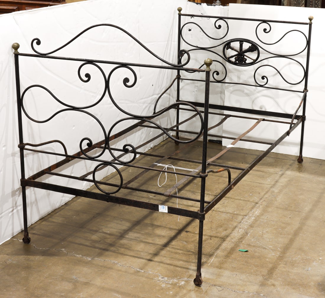 A Civil War era cast iron bed with brass finials: A Civil War era cast iron bed with brass finials, 42.5"h x 40"w