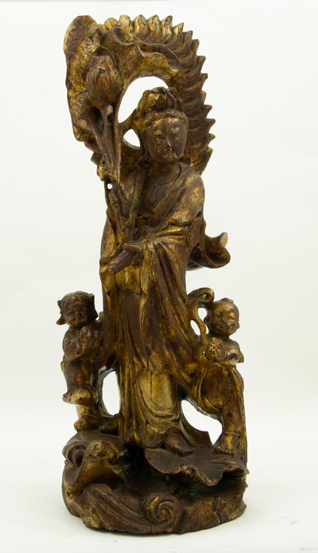 A Chinese gilt lacquered figure of Guanyin and attendants (1 of 1)