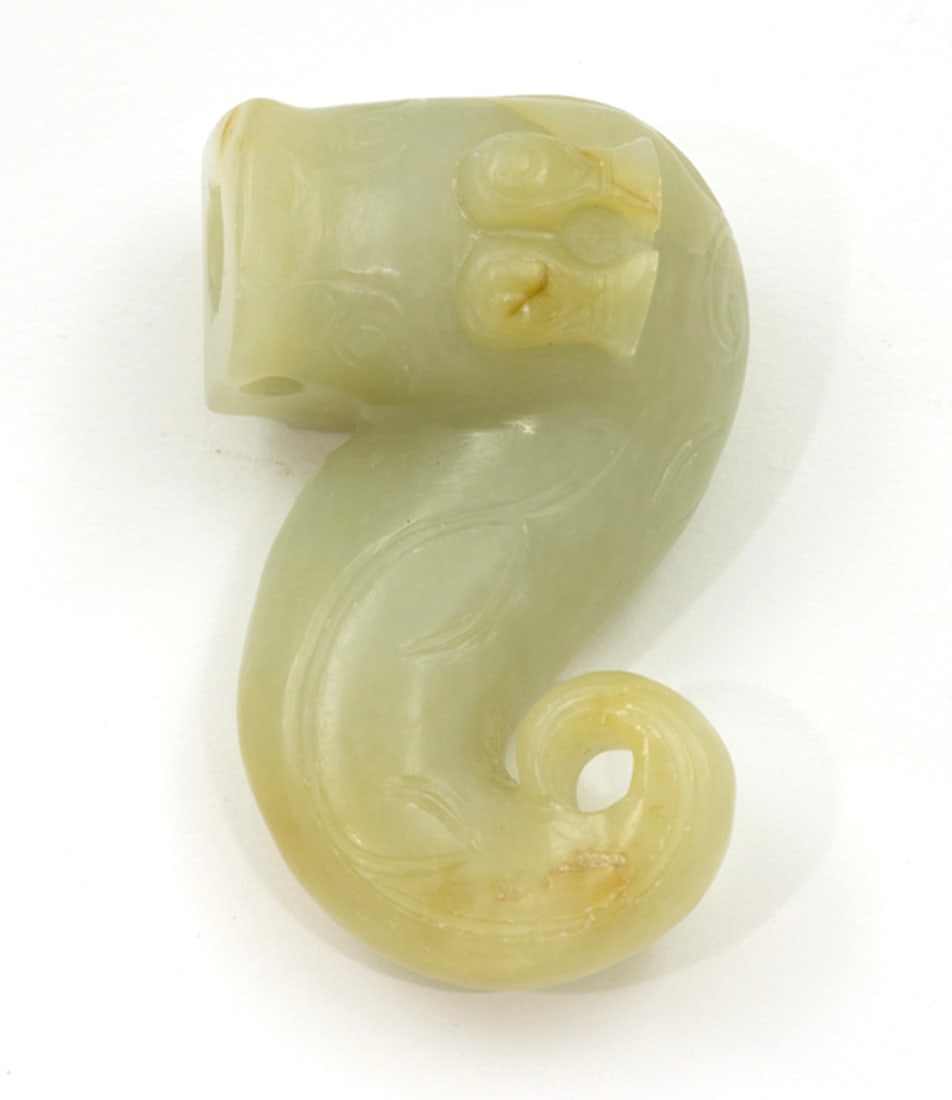 A Chinese russet and celadon jade dragon toggle (1 of 1)