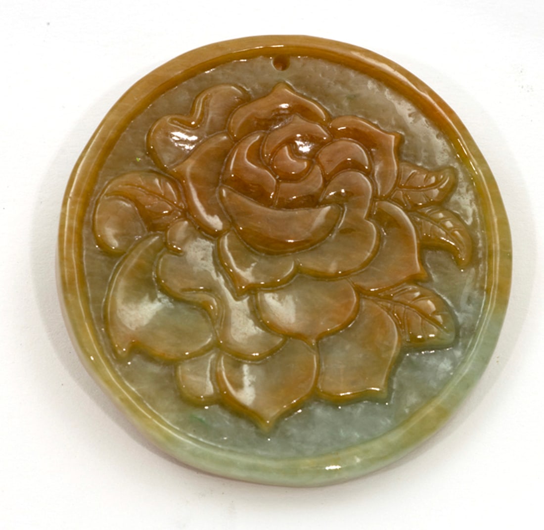 A Chinese russet and green jadeite plaque (1 of 1)