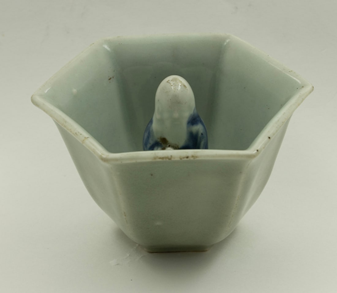 A Chinese blue and white and celadon ground 'justice' cup (1 of 3)