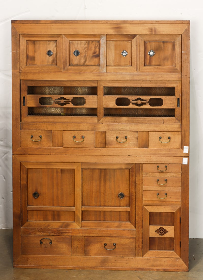 A Japanese two-part kitchen tansu: A Japanese two-part kitchen tansu. Early 20th century, 67.25"h x 47.5"w x 18.25"d.