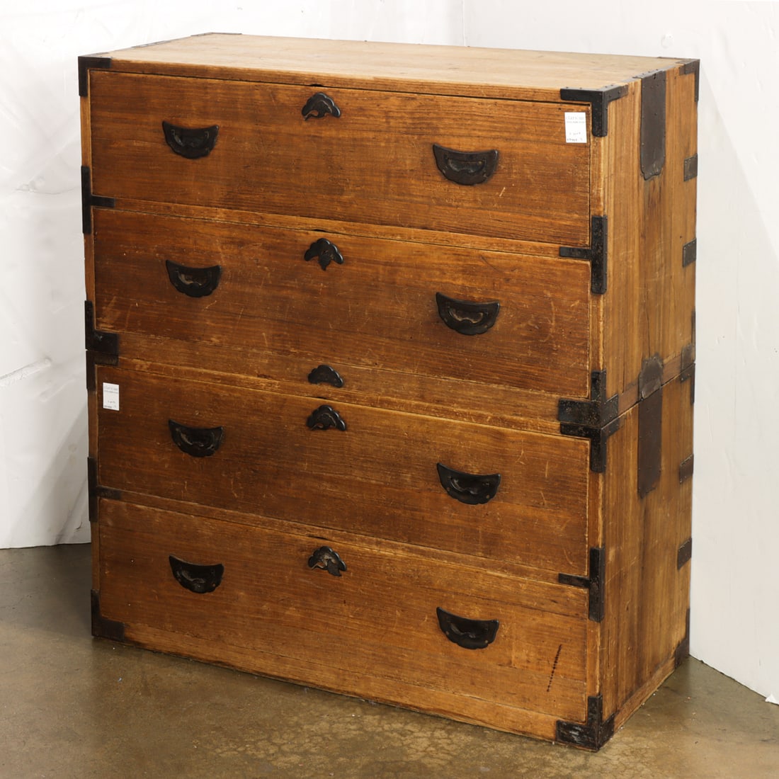 A Japanese two-part wardrobe tansu: A Japanese two-part wardrobe tansu. Early 20th century, 40.25"h x 37"w x 16.5"w.