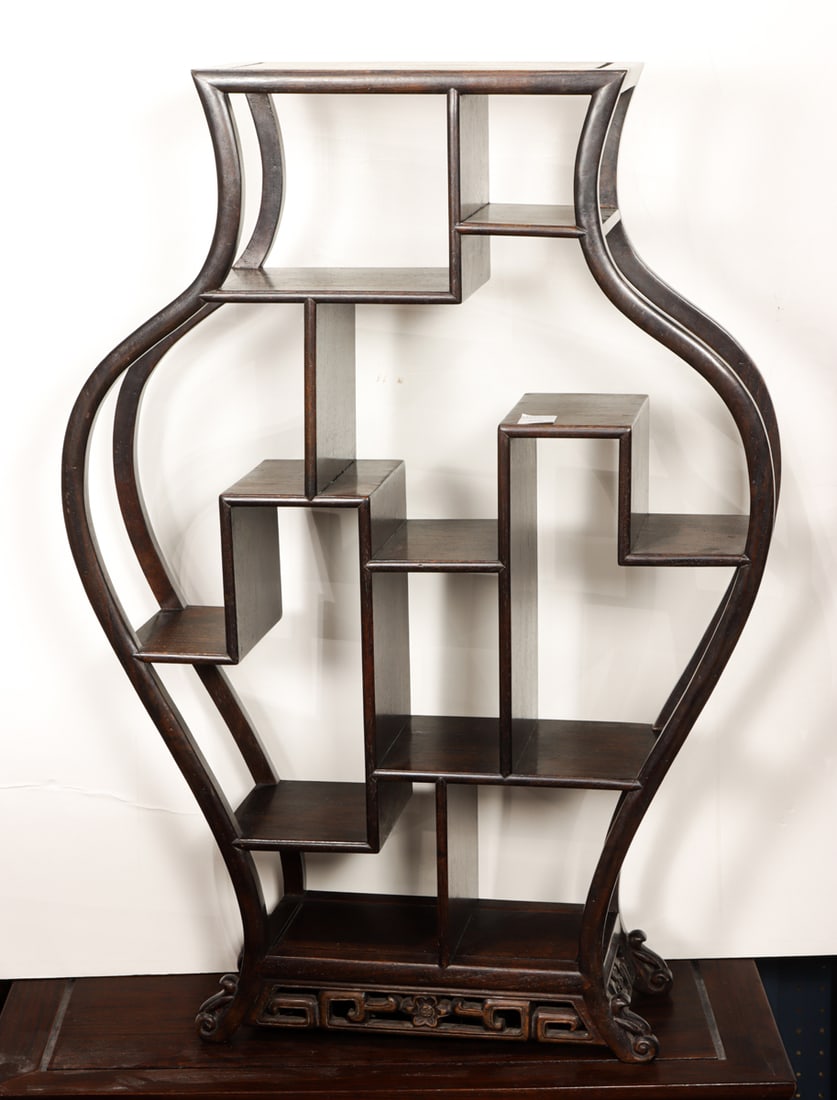 A Chinese rosewood curio shelf: A Chinese rosewood curio shelf. 20th century, 35"h x 25.5"w x 8"d.