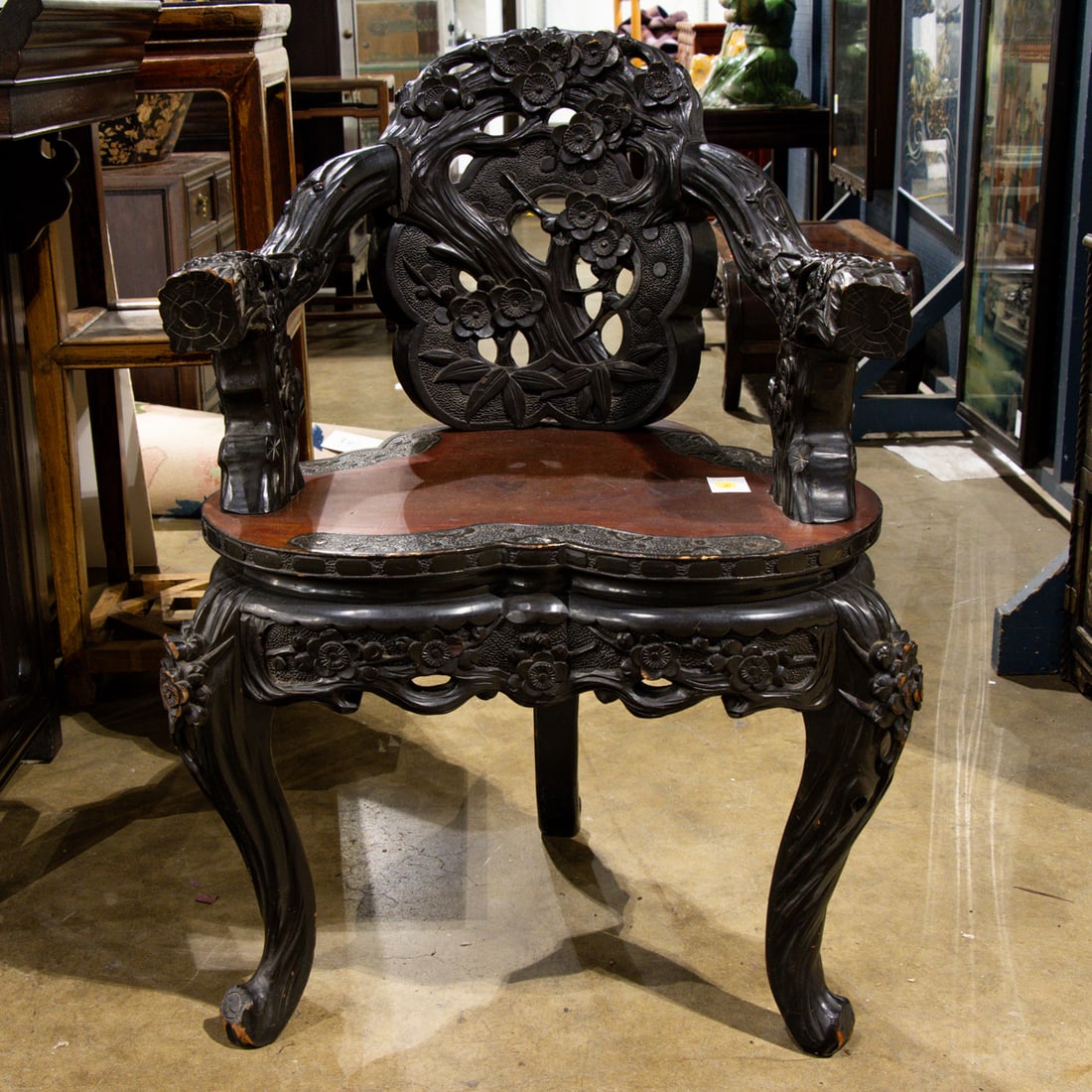 A Japanese carved wood chair: A Japanese carved wood chair. 31.75"h x 31.5"w x 18.5"d.