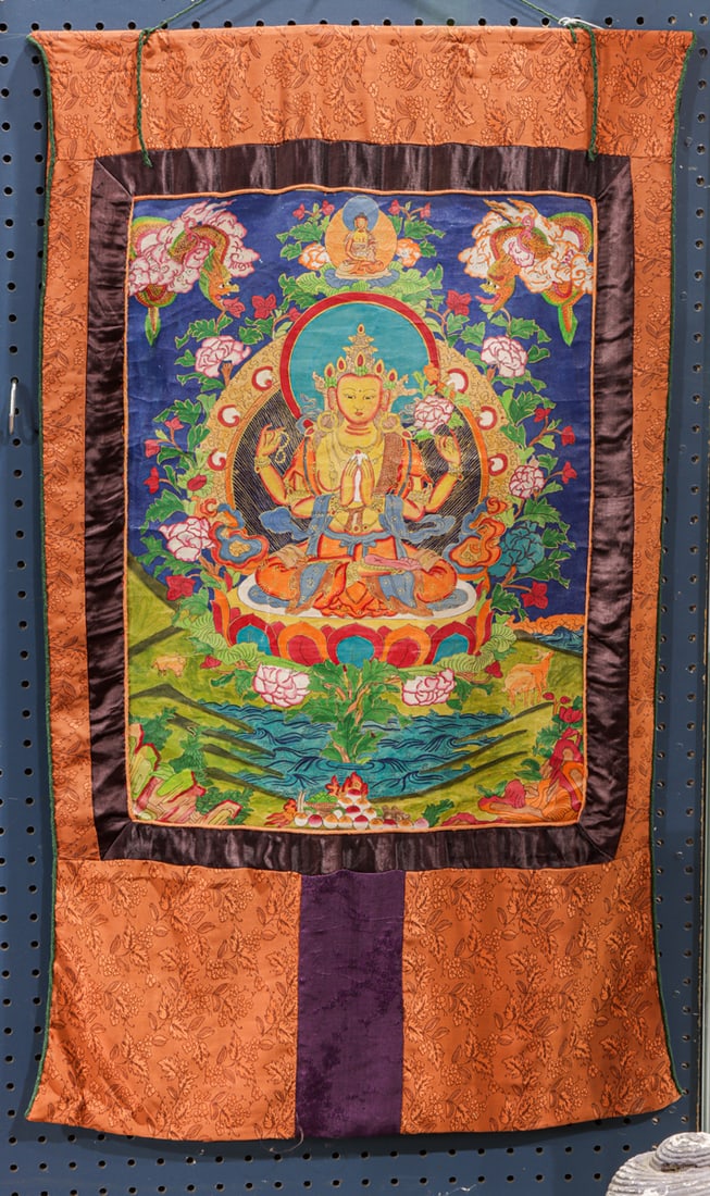 A Tibetan thangka: A Tibetan thangka. 20th century, 36.5"h x 22.5"w.
