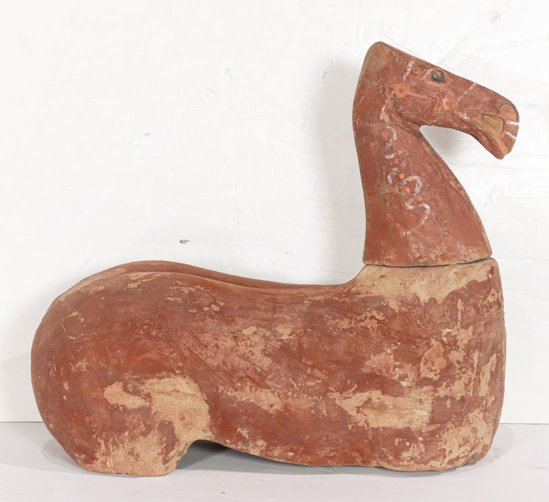 A Chinese painted pottery figure of a horse: A Chinese painted pottery figure of a horse. Han dynasty, with custom box, 17.5" wide.