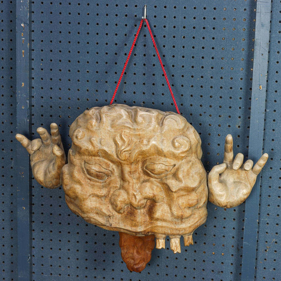 An Asian carved wood bell: An Asian carved wood bell. 20th century, 16.5"h x 25.5"w.