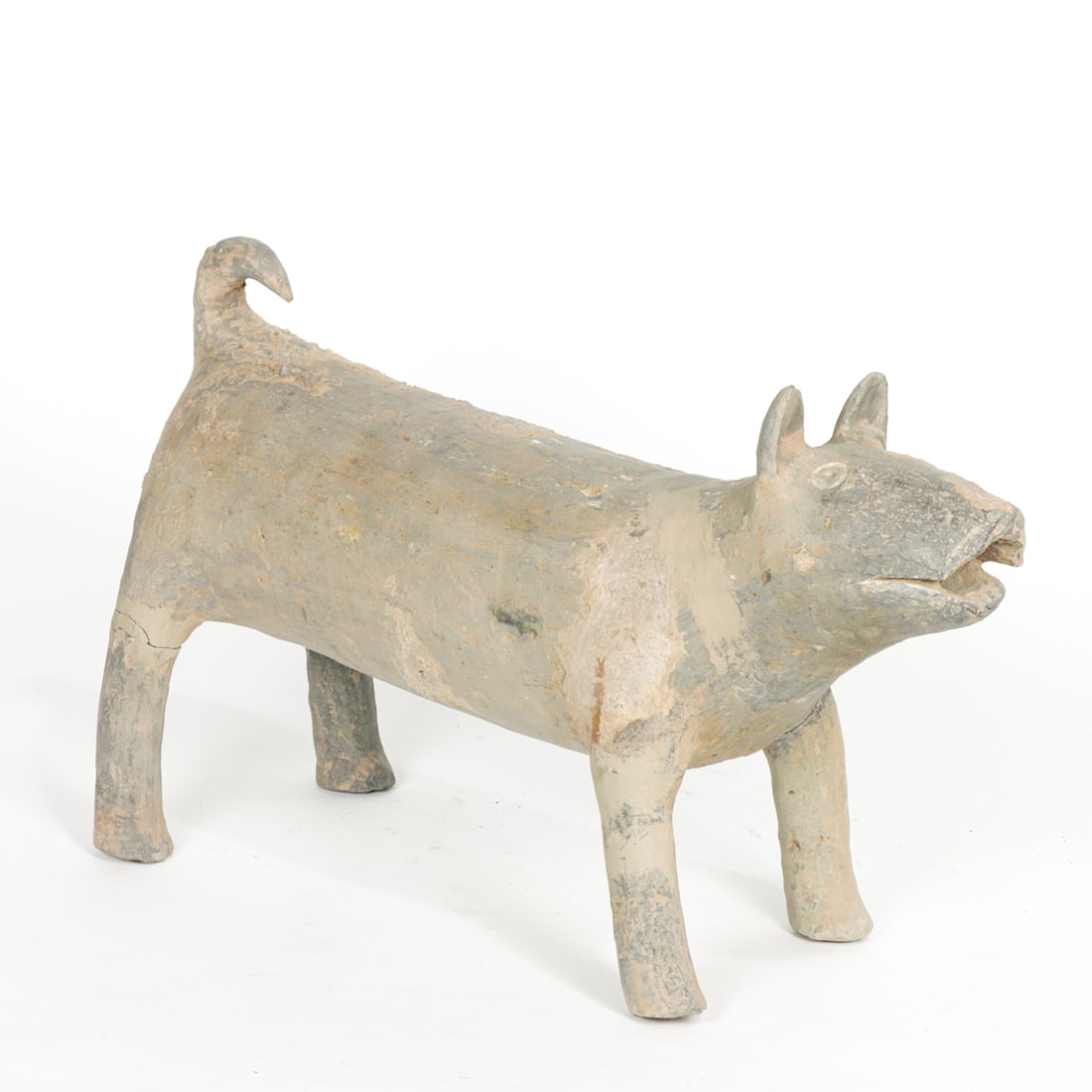A Chinese gray pottery dog figure: A Chinese gray pottery dog figure. Han dynasty, 18" long. Condition: two legs repaired