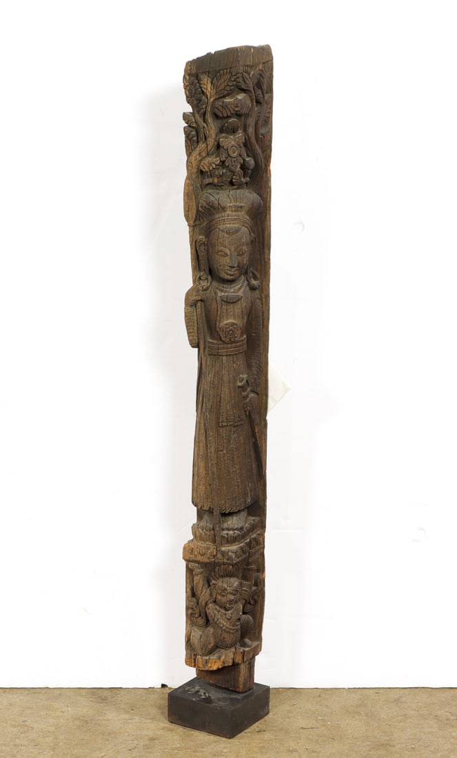 A Nepalese wood architecural strut man holding a sword: A Nepalese wood architecural strut man holding a sword. 18th century, 43.125" high excluding the stand.