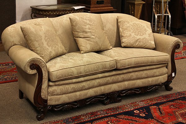 Rococo style settee: Rococo style settee, having a serpentine back continuing to the outswept arms accented with carved returns and rising on stylized legs conjoined by the floral carved skirt, 34"h x 79"w x 34"d