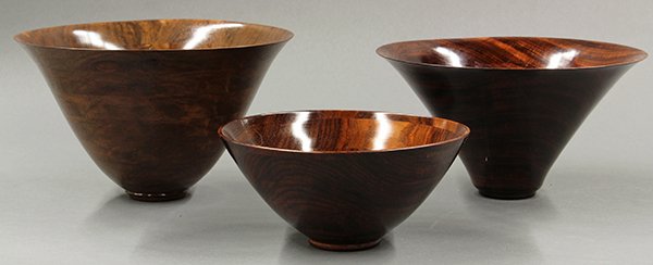 Michael Mode studio wooden turned bowls: (lot of 3) Michael Mode studio wooden turned bowls, 2001. Each of the contemporary bowls of conical form with flaring rims and thinly turned sides, each is signed, dated, and numbered. Largest: 5.5"h 
