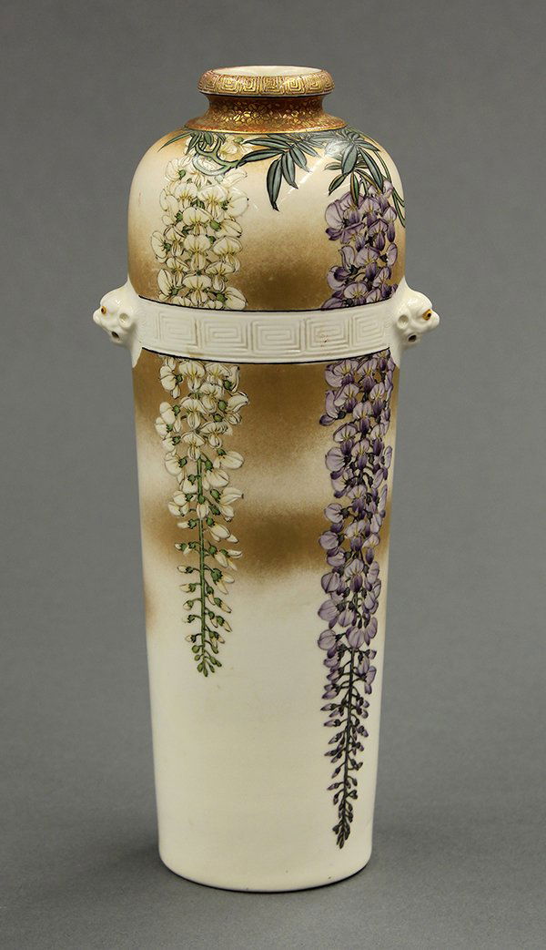 Japanese Satsuma-style Vase, Wisteria: Japanese Satsuma style earthenware vase, the rim accented with a key-fret band above the short bottle neck accented with gilt blossoms, the long tapering body decorated with branches of purple and whi
