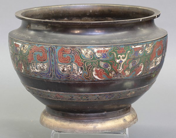 Japanese Enameled Champleve Jar: Japanese champleve vessel, the body enameled with a band of taotie masks on a turquoise ground, above a lower band accented with stylized flowers, 9"h x 12.75"w