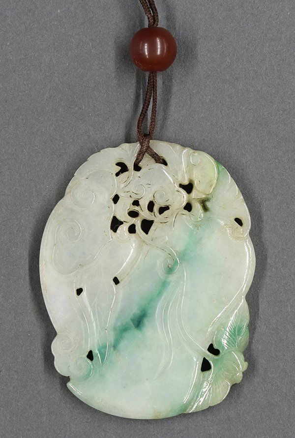 Chinese Melon Form Jadeite Plaque: Chinese jadeite plaque, in the form of a melon accented by leafy sprigs and lingzhi, the matrix mottled with green patches, 2.5"h