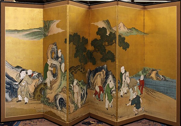 Japanese Painted Screen, Kano/Hara School: Japanese six-panel folding screen, 18th/early 19th Century, Kano/Hara School, ink, color and gold leaf on paper; featuring a group of Chinese children (karako) playing on and along a cluster of rocky 