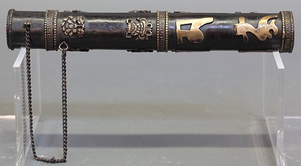 Himalayan Cylindrical Scroll Holder: Himalayan metal scroll holder, of cylindrical form with the eight Buddhist symbols in relief above six characters, 10.5"h
