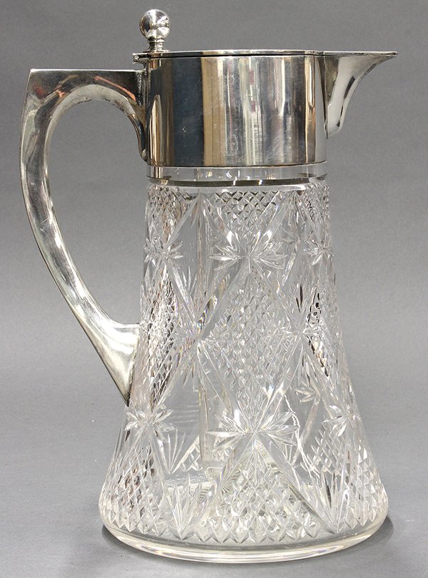 German crystal pitcher, having: German crystal pitcher, having .800 sterling silver lid and handle with mark of Gebr Friedlander, 11.25"h