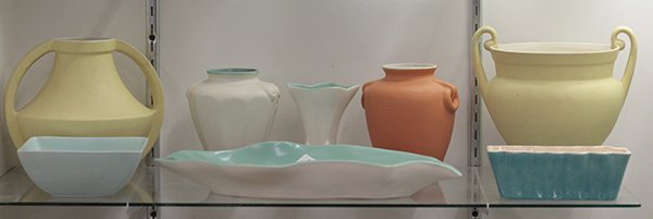 Art pottery by Coors, Gladding McBean, and LA Potteries: (lot of 8) Art pottery by Coors, Gladding McBean, and LA Potteries including two matte yellow classical style pots with double handles, a leaf form low dish with celadon interior glaze and white exter