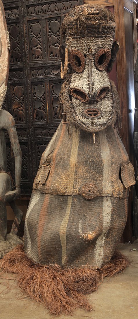 Papua New Guinea, huge dance costume: Attributed to Palembai Village, Sepik River, Papua New Guinea, huge dance costume of polychrome decorated woven rattan fiber, worn completely over a dancer's body, with a large head, nose with a pierc