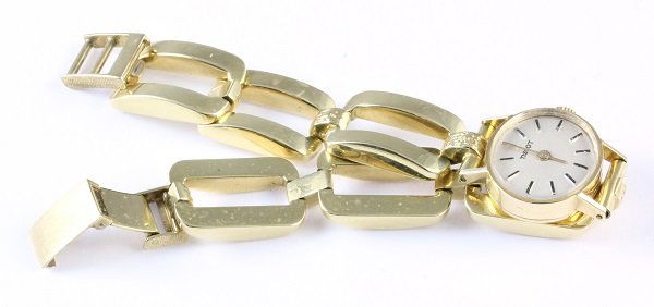 Lady's Tissot wristwatch: Lady's Tissot wristwatch Tissot 14k yellow gold buckle style wristwatch, quartz converted. Total wristwatch weight 27.3 grams without movement. Wristwatch length 7.25"