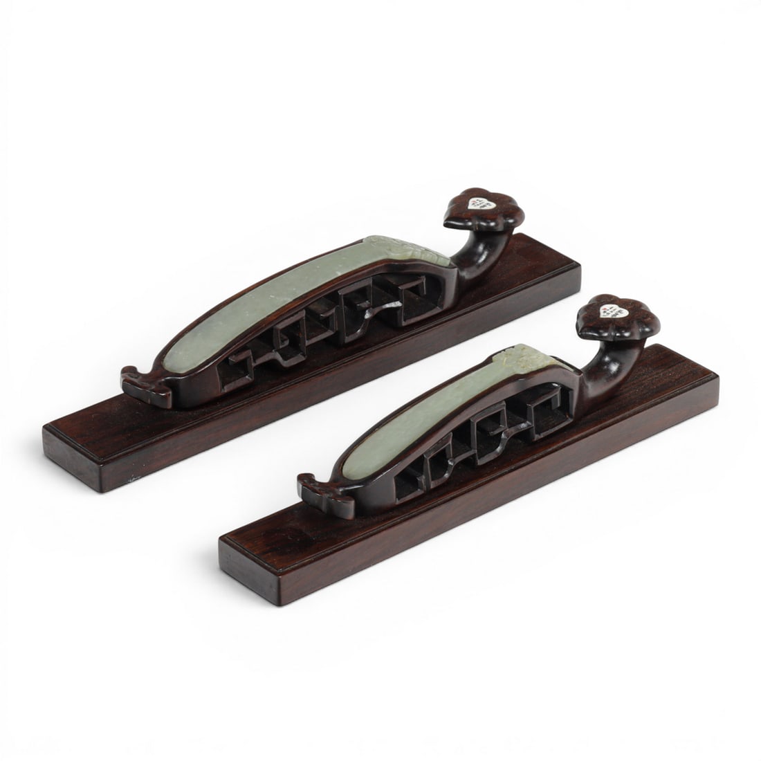 Two Chinese Ruyi scepter jade hairpins: Two Chinese Ruyi scepter jade hairpins, mounted as paperweights, overall 10"l and 9"l. Provenance: The Estate of Senator Dianne Feinstein (1933?2023) and Richard C. Blum (1935?2022)