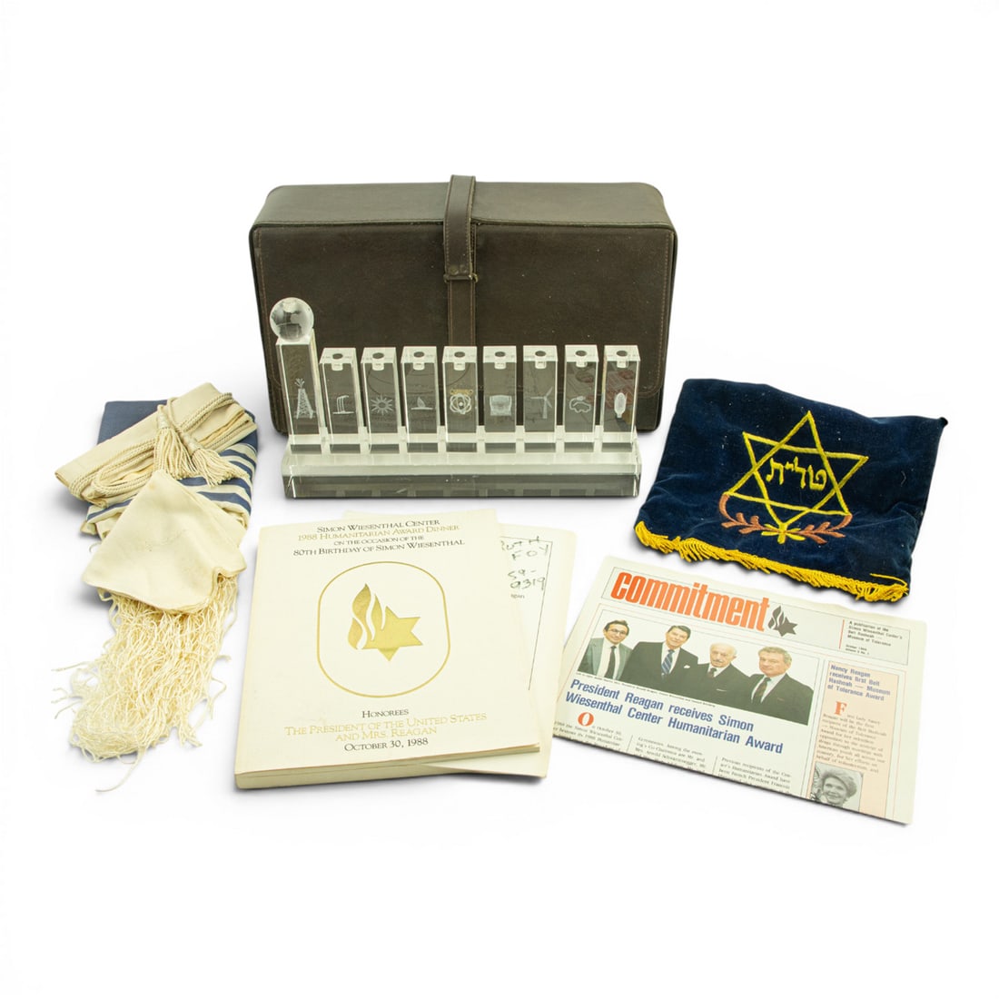 A group of Judaica: A group of Judaica, including glass menorah for Simon Wiesenthal Center, 8"h x 13.5"w x 2.5"d. Provenance: The Estate of Senator Dianne Feinstein (1933?2023) and Richard C. Blum (1935?2022)
