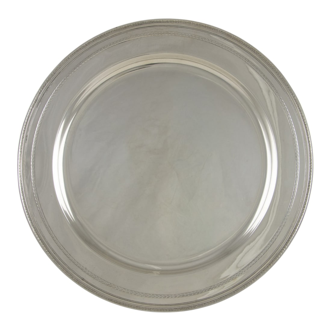 A Gorham sterling charger in the Edgworth pattern (1 of 3)