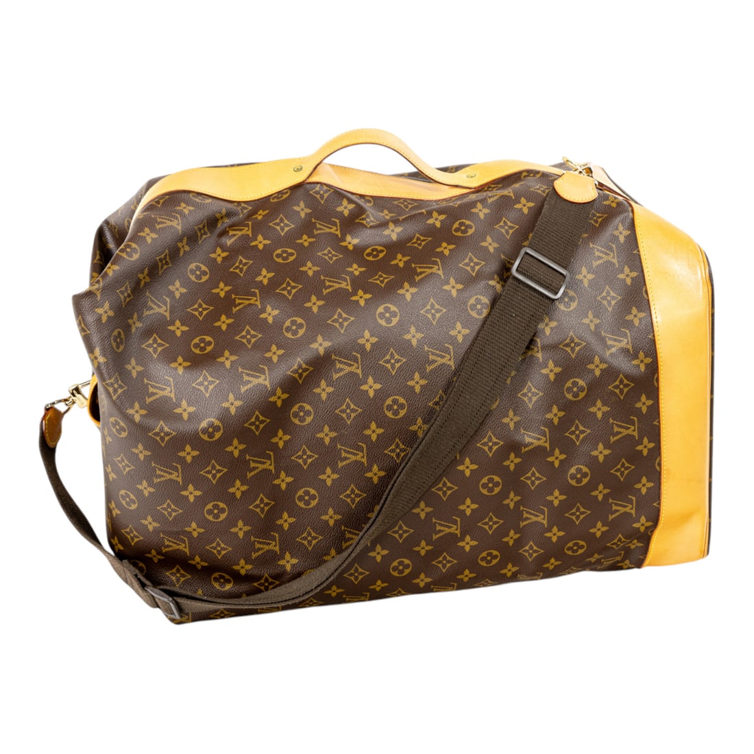 A Louis Vuitton monogram canvas Sac Marine shoulder duffle bag, date code N0099, the fold over: A Louis Vuitton monogram canvas Sac Marine shoulder duffle bag, date code N0099, the fold over closure opening to a spacious canvas-lined interior, featuring vachetta leather trim, a single