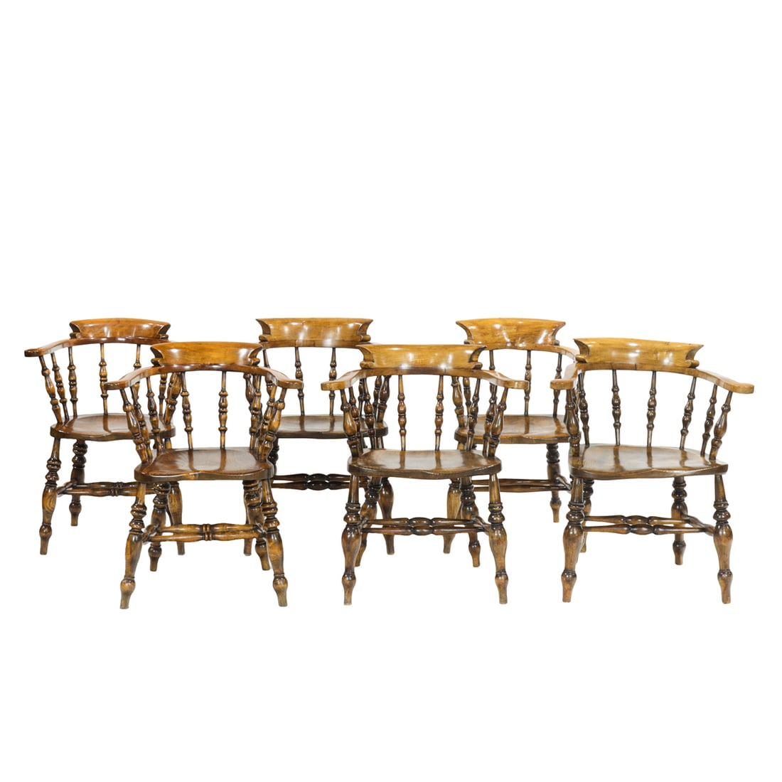 A set of six English bow-back captain chairs: A set of six English bow-back captain chairs, each contoured top and turned spindle supports continuing to the plank seat, and rising on turned legs, in two sizes, (3) 32"h x 20.5"w x 20"d (overall); 