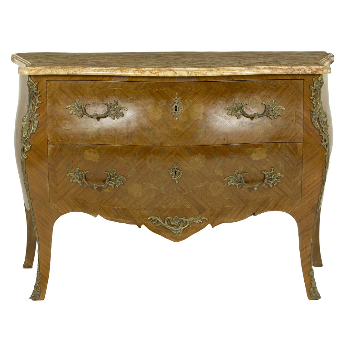 A Louis XV style serpentine two drawer commode circa 1900: A Louis XV style serpentine two drawer commode circa 1900, the marble top above the two drawer case of bombe form with floral marquetry and patinated mounts, rising on outswept legs terminating on