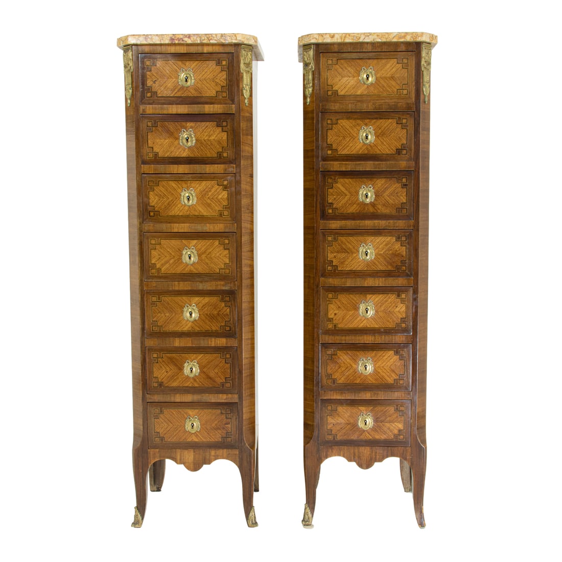 A pair of French Louis XV style lingerie chests (semainiers): A pair of French Louis XV style lingerie chests (semainiers), each having a variegated marble top above the gilt bronze mounted seven drawer case, each with marquetry decorated fronts, and rising on