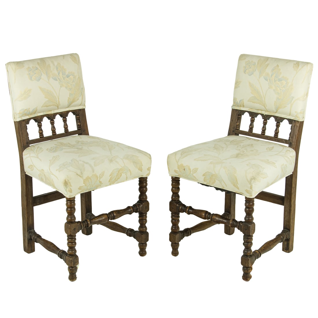 A pair of Spanish Revival side chairs: A pair of Spanish Revival side chairs, each with a turned spindle decorated back and rising on block and turned legs, 32"h x 16.5"w x 15"d (overall); 14"d (seat)