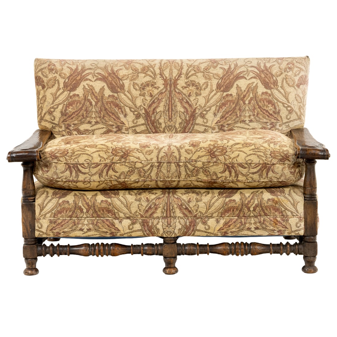 A Spanish Revival upholstered settee: A Spanish Revival upholstered settee, the square upholstered back, over loose down filled seat cushion, shaped arms ending in scrolls, and rising on turned supports, 33"h x 51"w x 31"d (overall); 23"d
