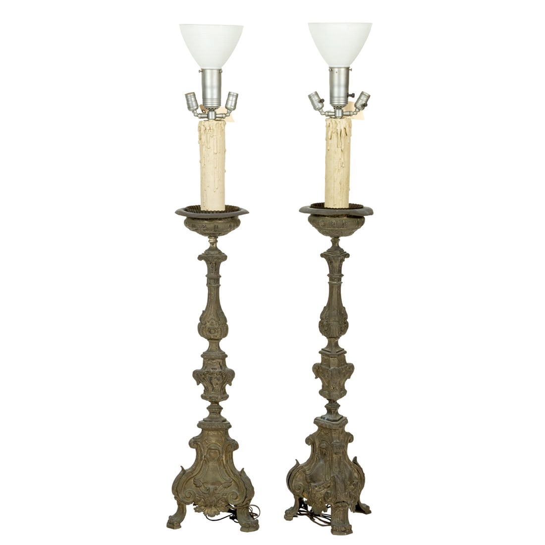 A pair of patinated metal torchieres in the Baroque taste circa 1930: A pair of patinated metal torchieres in the Baroque taste circa 1930, 57"h (fixture) x 11"sq