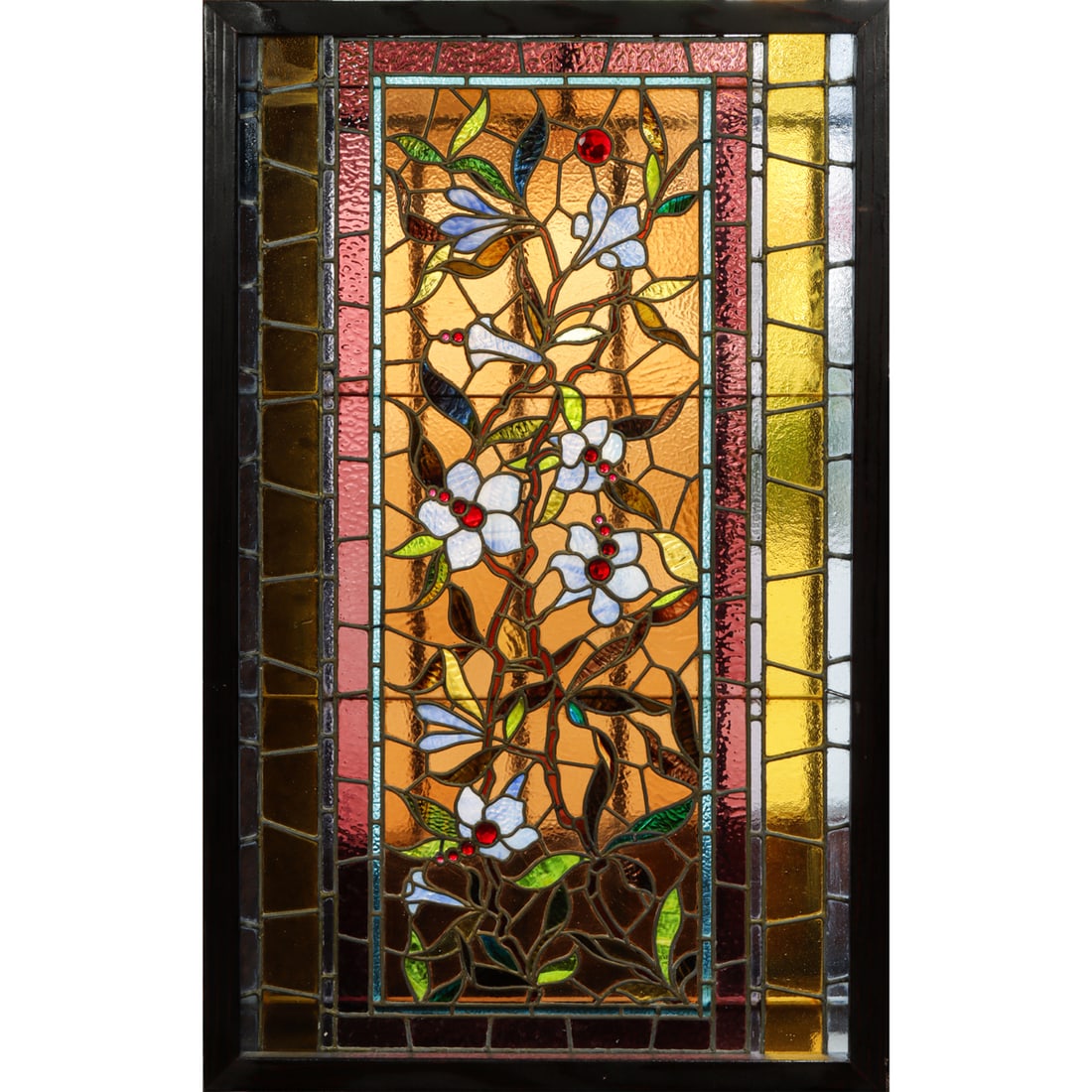 An American Victorian Aesthetic Movement stained glass window 19th century: An American Victorian Aesthetic Movement stained glass window 19th century, the rectangular panel with floral sprays centered with crimson jewels set within a wood moulding, 46"h x 28.5"w x 1.5"d