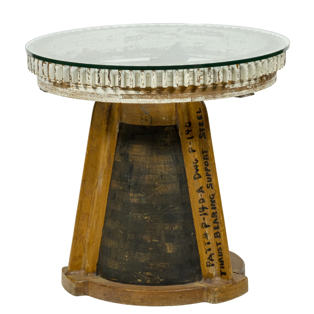 A Folk Art gear table with glass top: A Folk Art gear table with glass top, base marked in ink 'Ethyl Corp. Baton Rouge', LA, overall 33"h x 32"dia