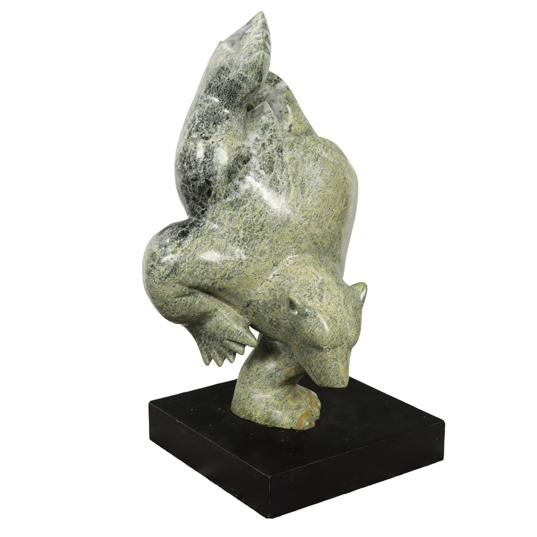 An Inuit carved Dancing Bear sculpture: An Inuit carved Dancing Bear sculpture, depicted standing on one arm, and resting on a revolving base, 21"h x 10"sq