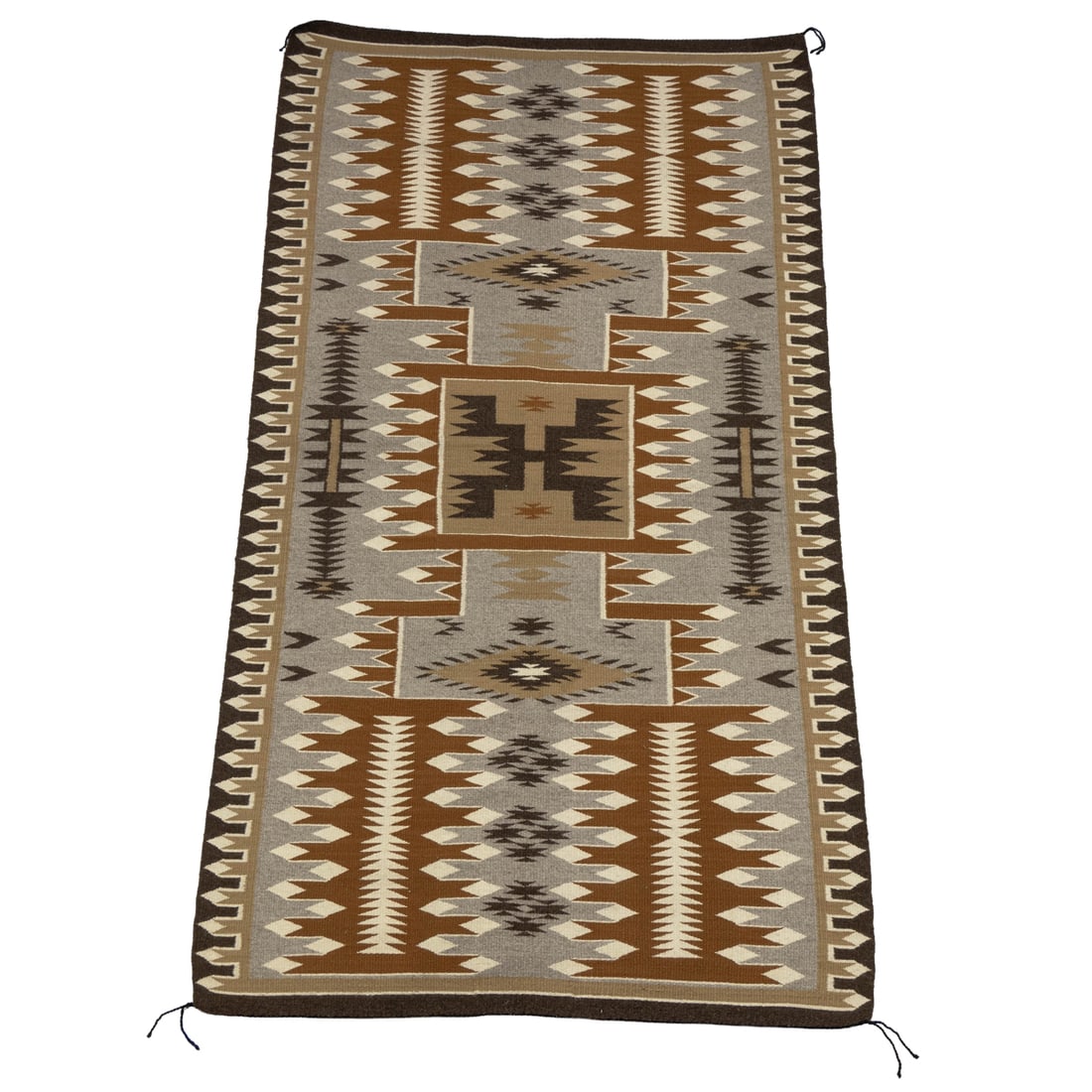 A Navajo blanket: A Navajo blanket, woven in tones of brown, 68"l x 38.5"w