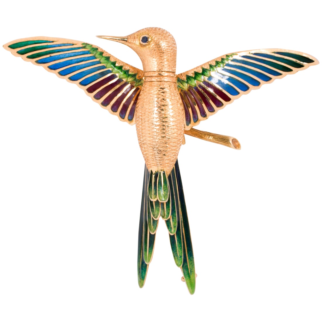 An enamel and 18k gold hummingbird brooch: An enamel and 18k gold hummingbird brooch The hummingbird accented by detailed etching, articulated plique-a-jour enamel wings and tail, and sapphire eyes; length: 2 in; 16.85 grams