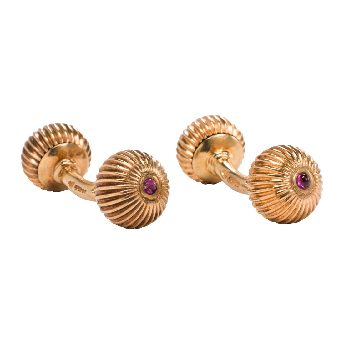 A pair of Garrard ruby and 9k gold cufflinks: A pair of Garrard ruby and 9k gold cufflinks the double-sided cufflinks with fluted ball-form ends set with round cabochon rubies; with original box; length: 1 1/4 in; 16.13 grams