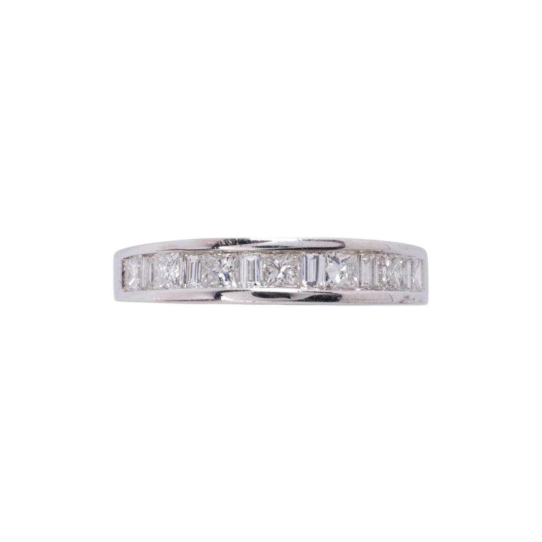 A diamond and 18k white gold band: A diamond and 18k white gold band channel-set with 13 princess and baguette-cut diamonds, weighing in total approximately 1.00 carat; size 7; 4.15 grams